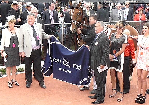 Saveapatrol is joined by winning owner Grant Hatton (light jacket), other connections and sponsors, following the Avon City Ford Mobile Pace. 